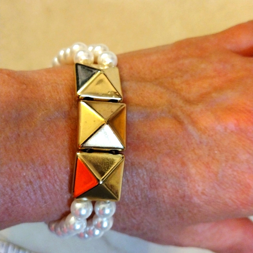 Beautiful Stretch pearls and gold sliding charms bracelet.